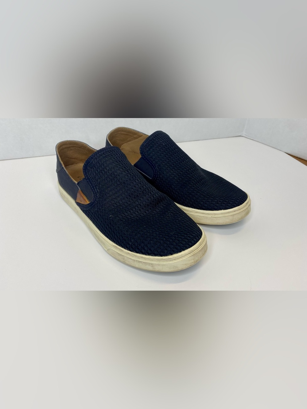 Olukai black slip on loafers